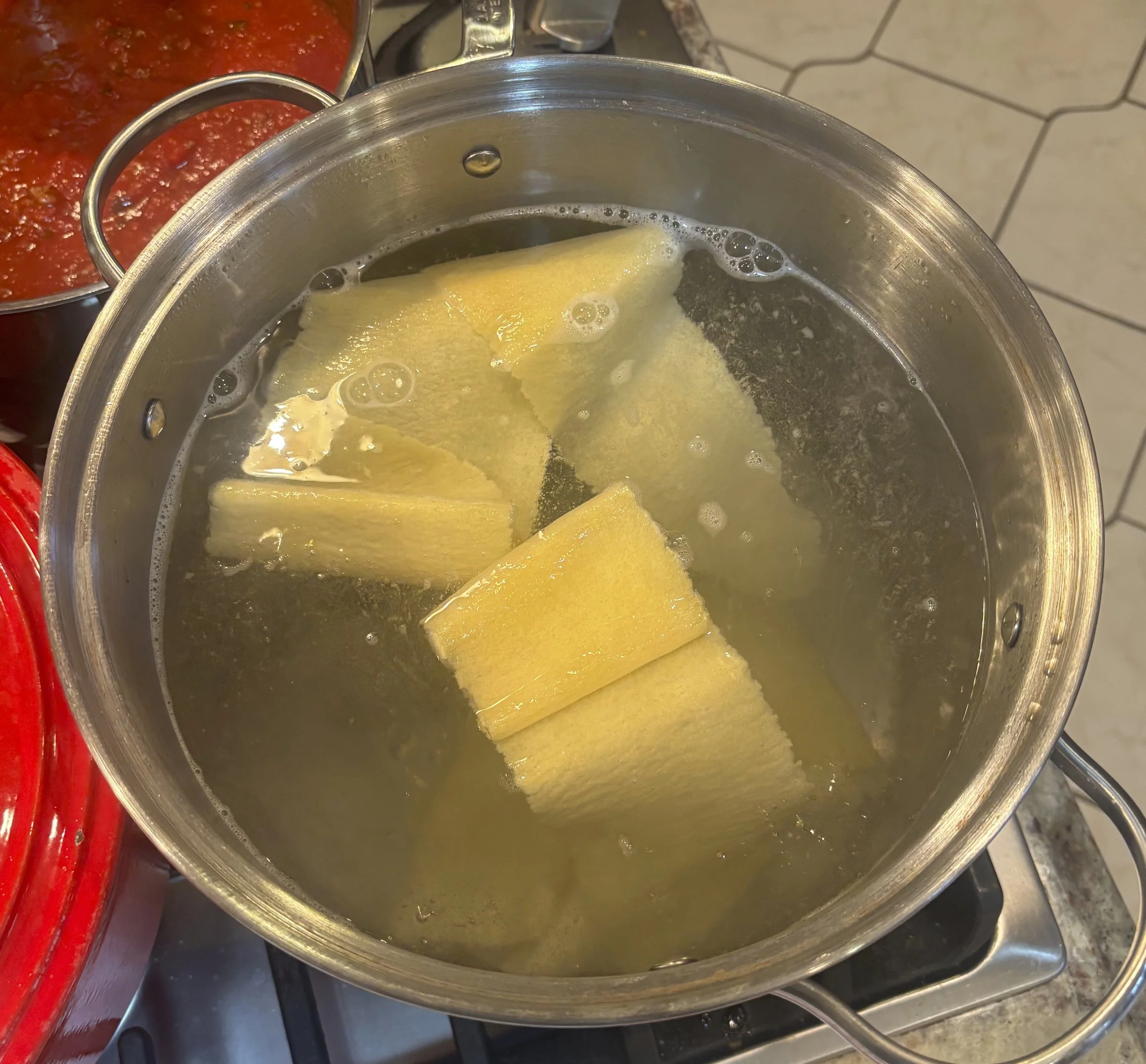 Put first layer of pasta in boiling water for a few minutes
