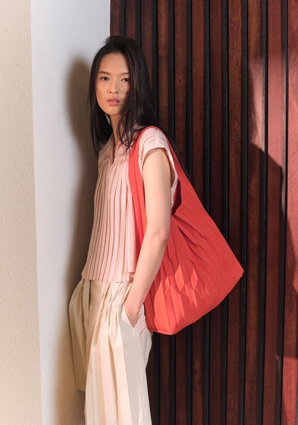 GINLEE’s signature pleats. Image courtesy of GINLEE. Photo by Ivanho Harlim.
