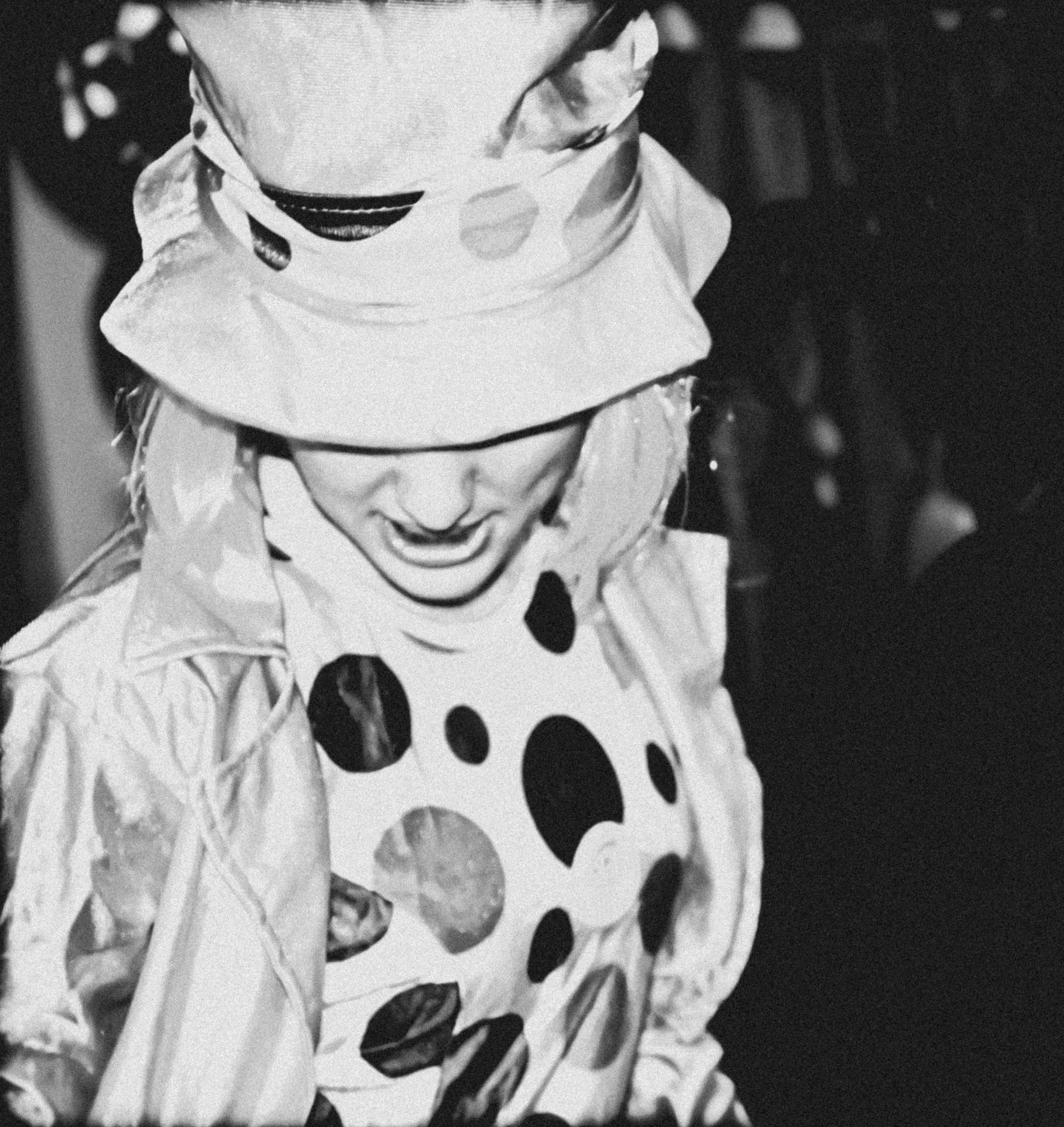 Birthday party polka dotted clown entertaining the children