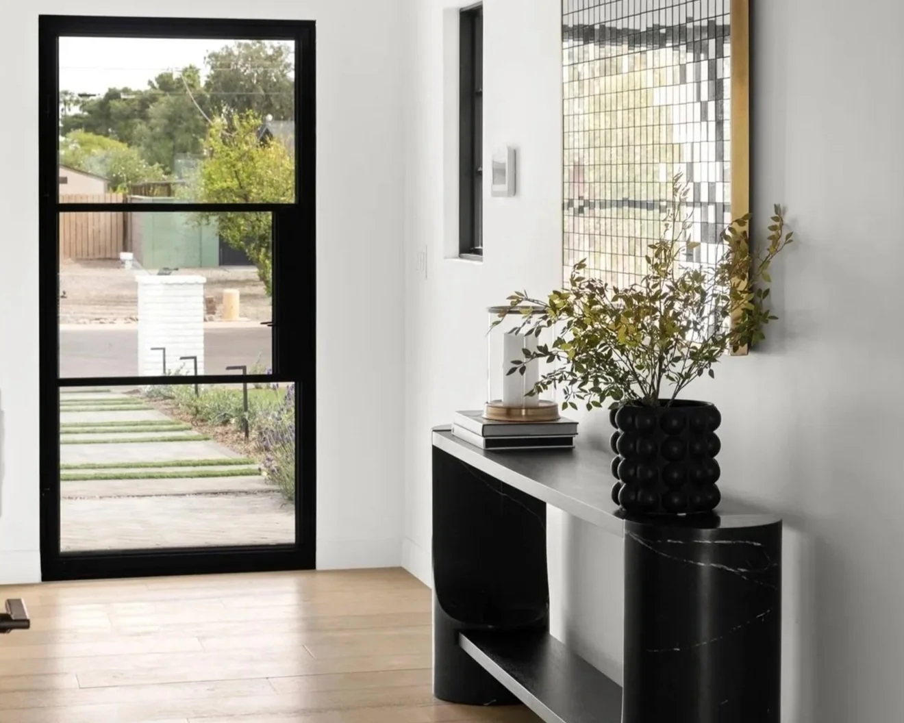 Bex Collective interior entryway with styled console and mirror