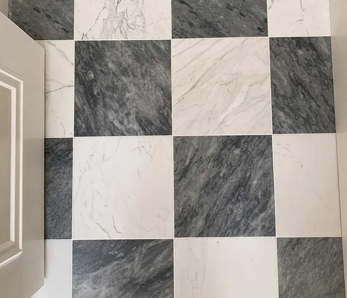 Checkerboard marble tile wall detail in a Phoenix bathroom renovation
