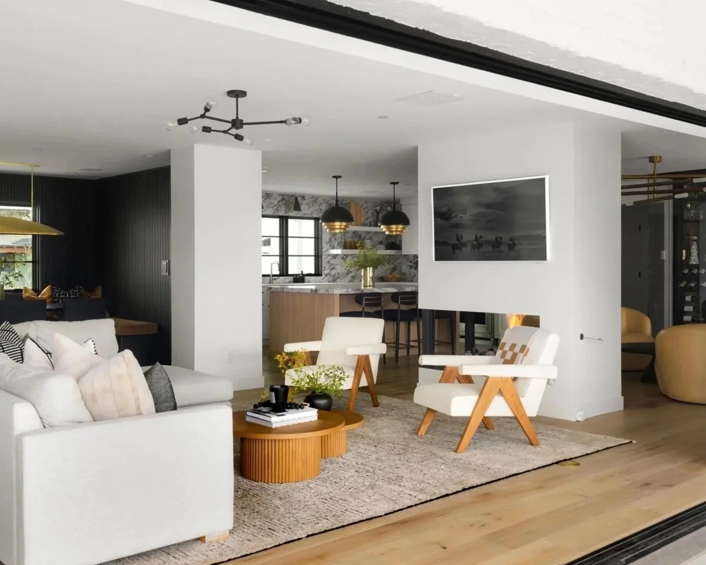 Open-concept living room and kitchen designed by Bex Collective