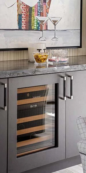 Built-in home bar with wine fridge and custom cabinetry in a Tempe residence