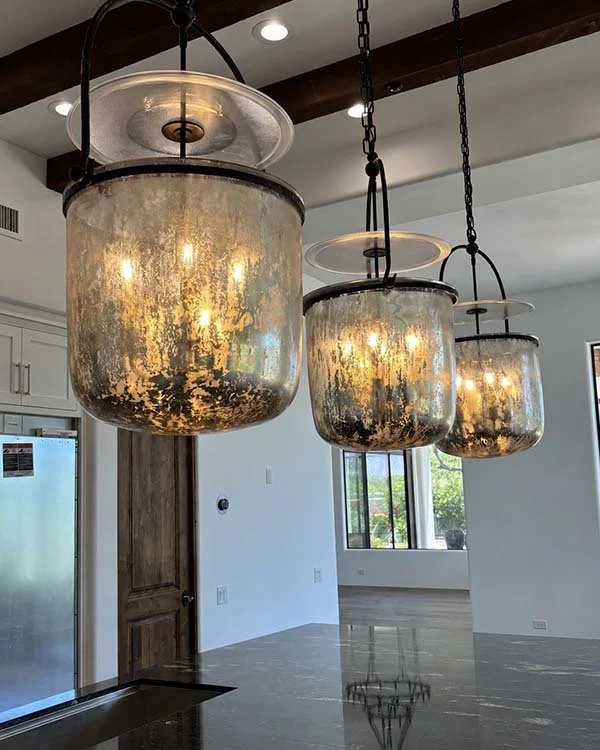 Statement glass pendant lights above a kitchen island in a Scottsdale interior design project