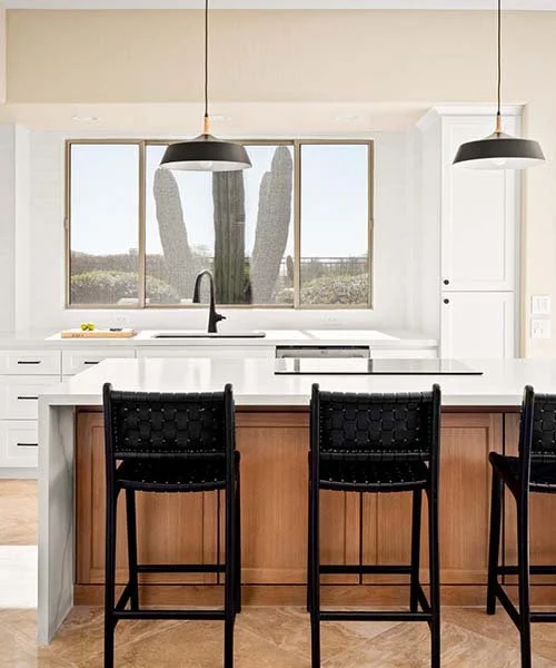 Modern Scottsdale kitchen with large island, pendant lighting, and desert view windows