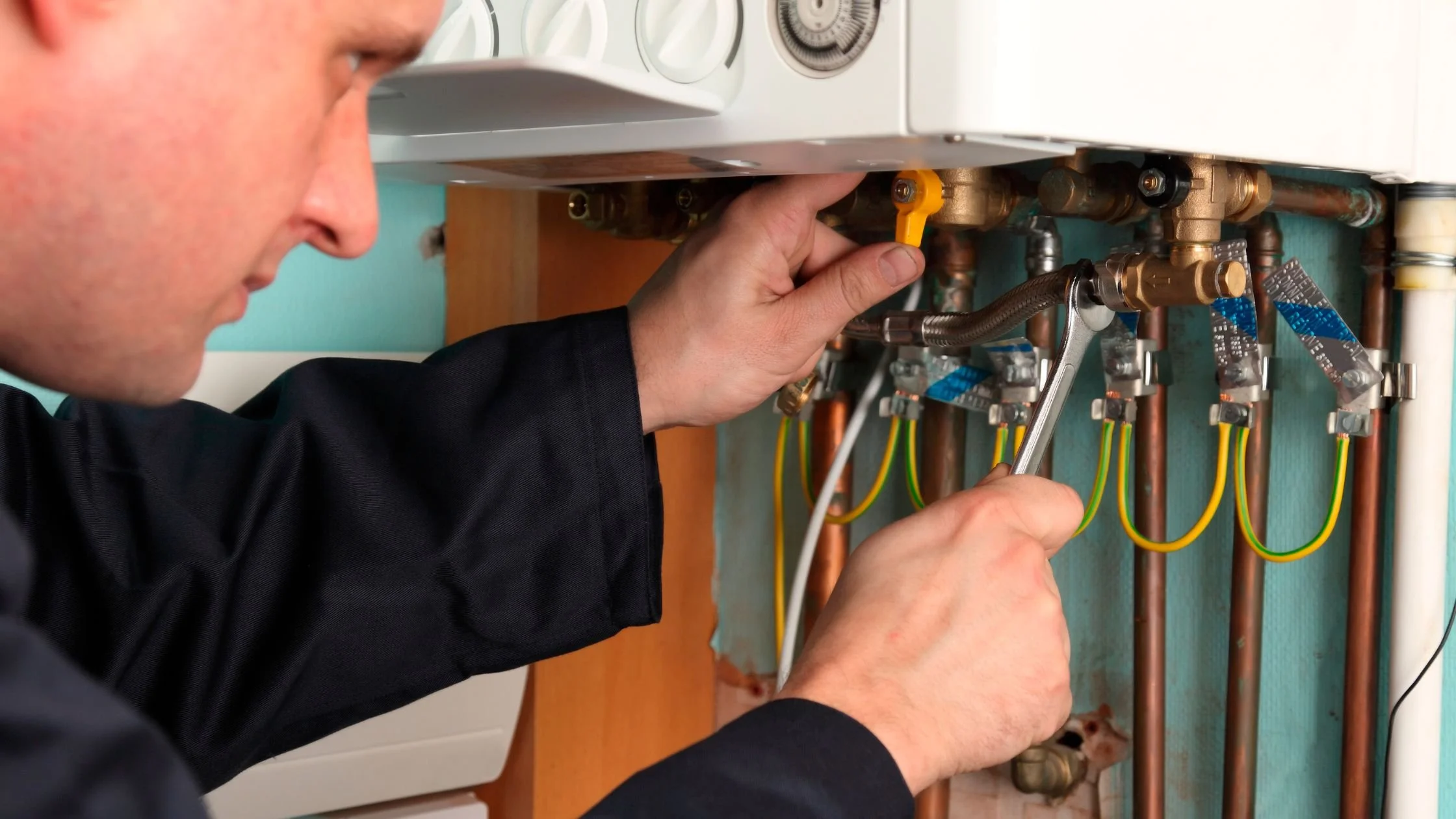 engineer in South Wales repairing a gas boiler