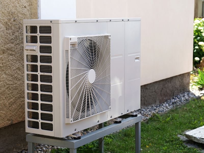 Air source heat pump installed outside a home in South Wales