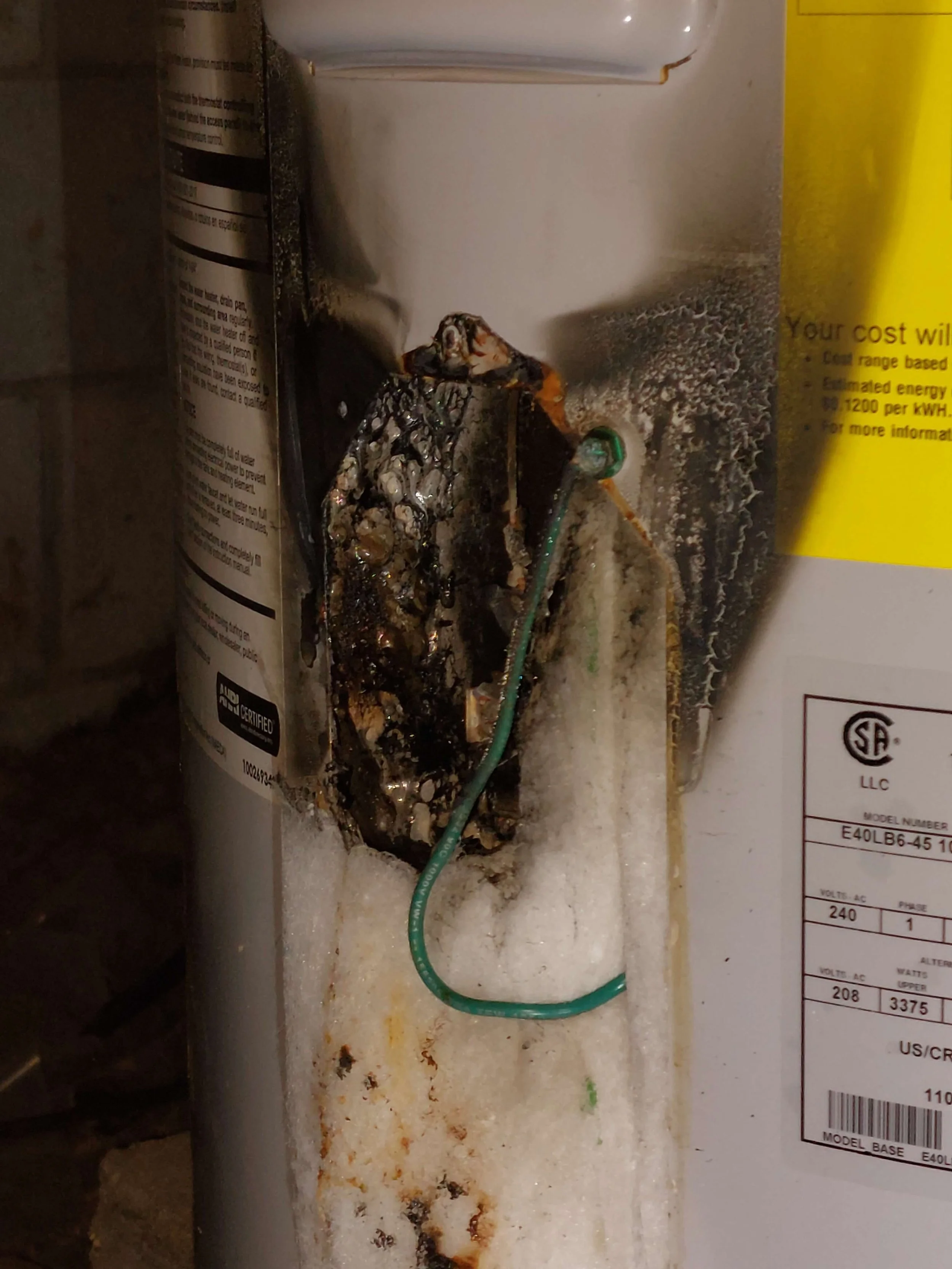 A water heater that suffered from electrical issues causing the heating element to melt the surrounding enclosure