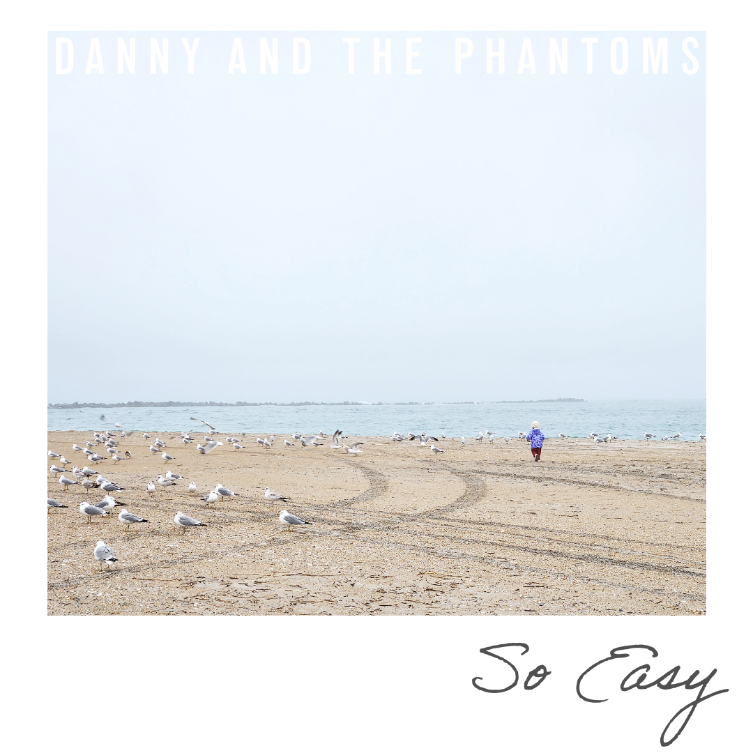 Beach scene with seagulls on the sand, a person walking toward the water, and the ocean in the background. Text at the top reads 'DANNY AND THE PHANTOMS,' and at the bottom, 'So Easy'.