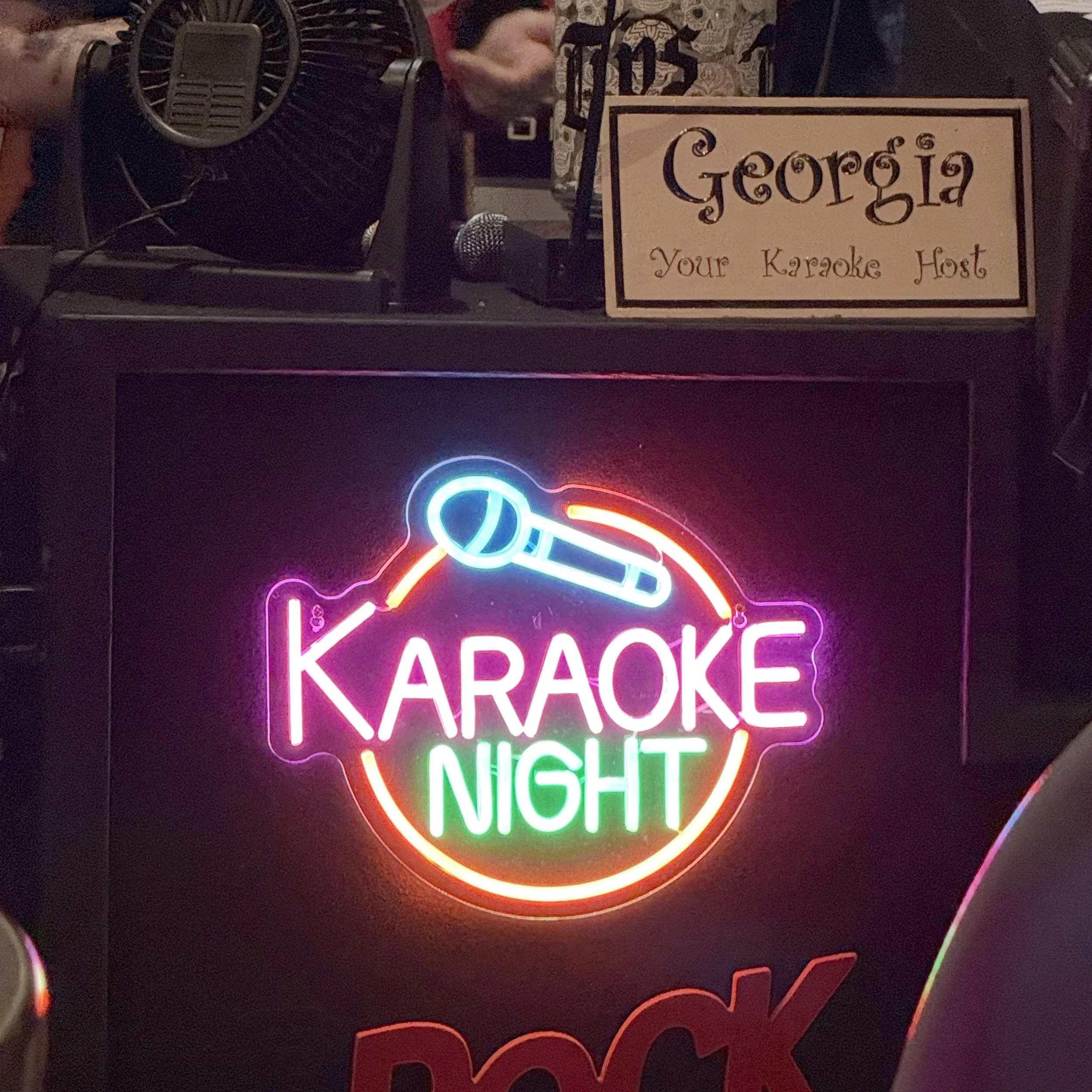 Karaoke Night sign and karaoke host Georgia’s booth at Play Station Pub on Leonard Street in Grand Rapids, Michigan, during the GRkaraoke.com Karaoke Marathon 2026