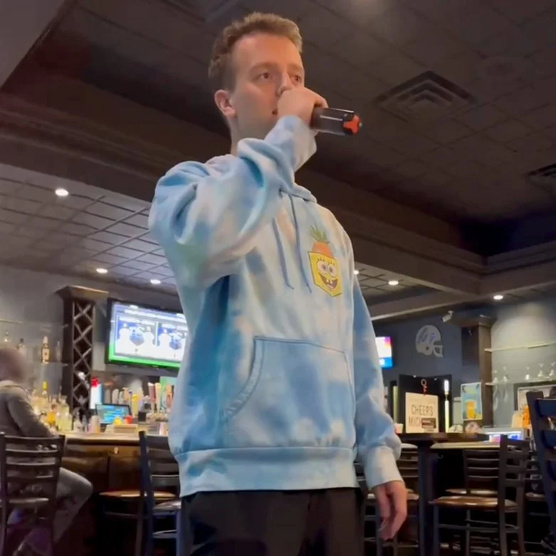 GRkaraoke.com founder Chris singing karaoke at PigSkins & Pints in Grand Rapids, Michigan, during the Karaoke Marathon 2026