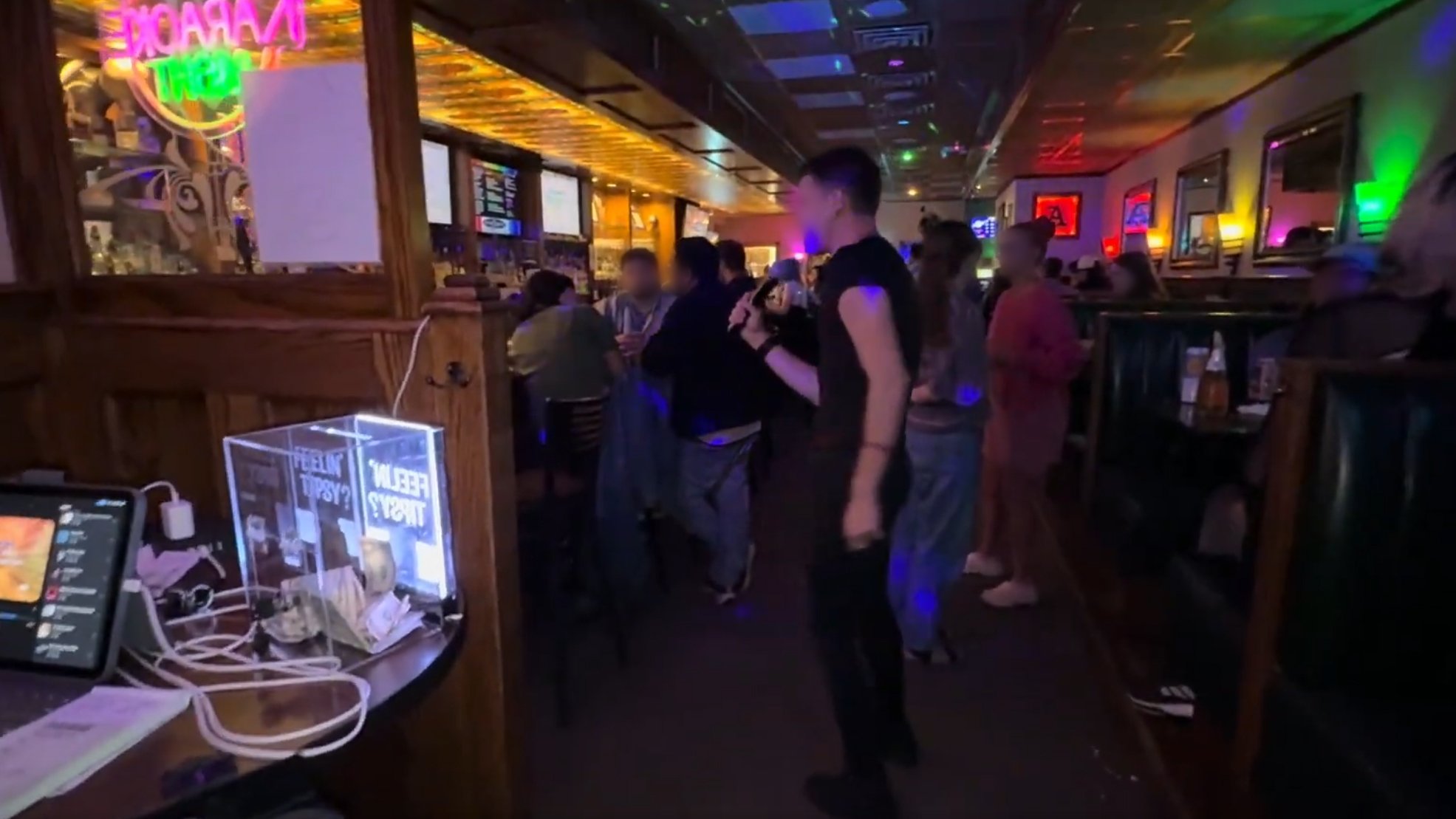 View from the karaoke stage at The Apartment Lounge in downtown Grand Rapids, Michigan, with a singer performing for the crowd during the GRkaraoke.com Karaoke Marathon 2026