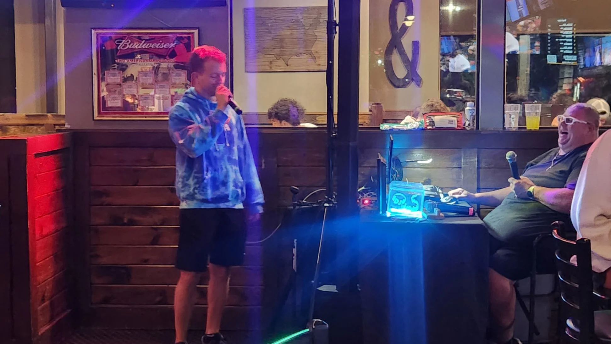 GRkaraoke.com founder Chris singing karaoke at Main St. Pub in Allendale, Michigan, with Absolute Entertainment karaoke host Mikey K. during the Grand Rapids Karaoke Marathon 2026