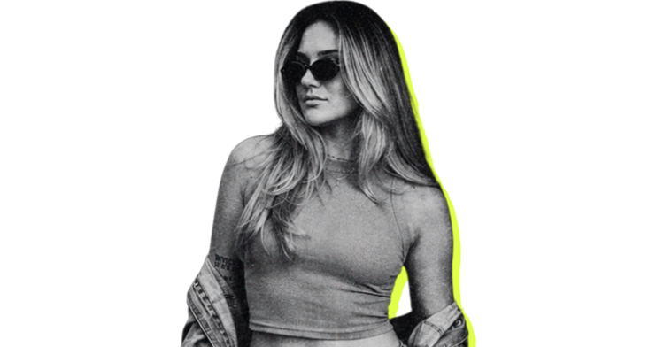 Michelle in sunglasses with a jacket over her shoulders