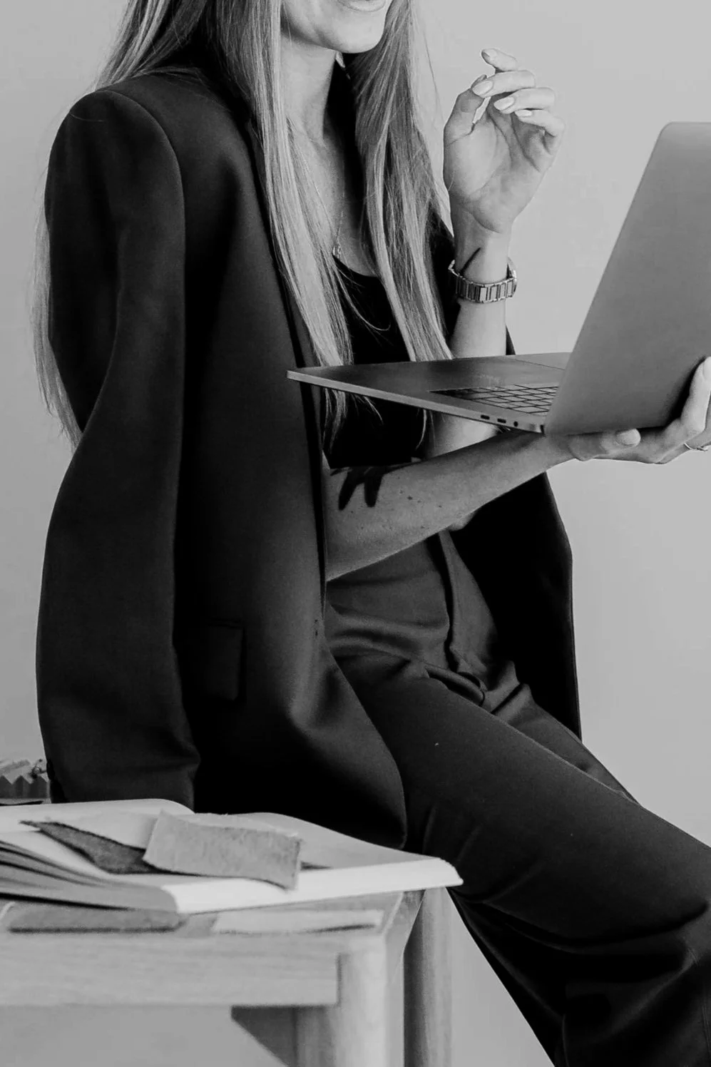 Business owner holding a laptop