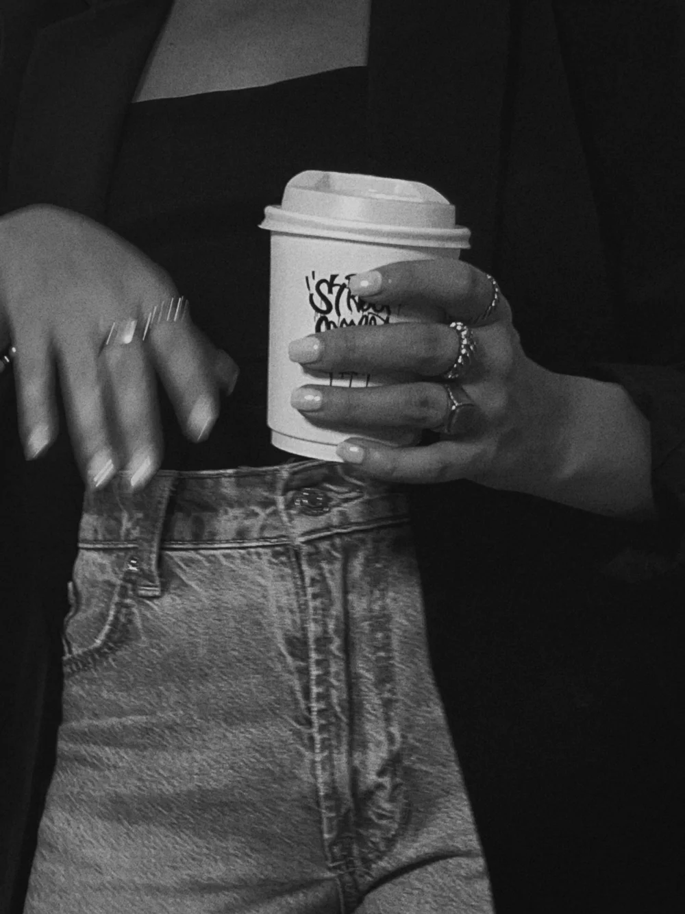 Person holding a coffee cup