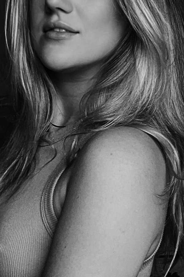 Black and white portrait of Michelle, founder of Slay Your Systems