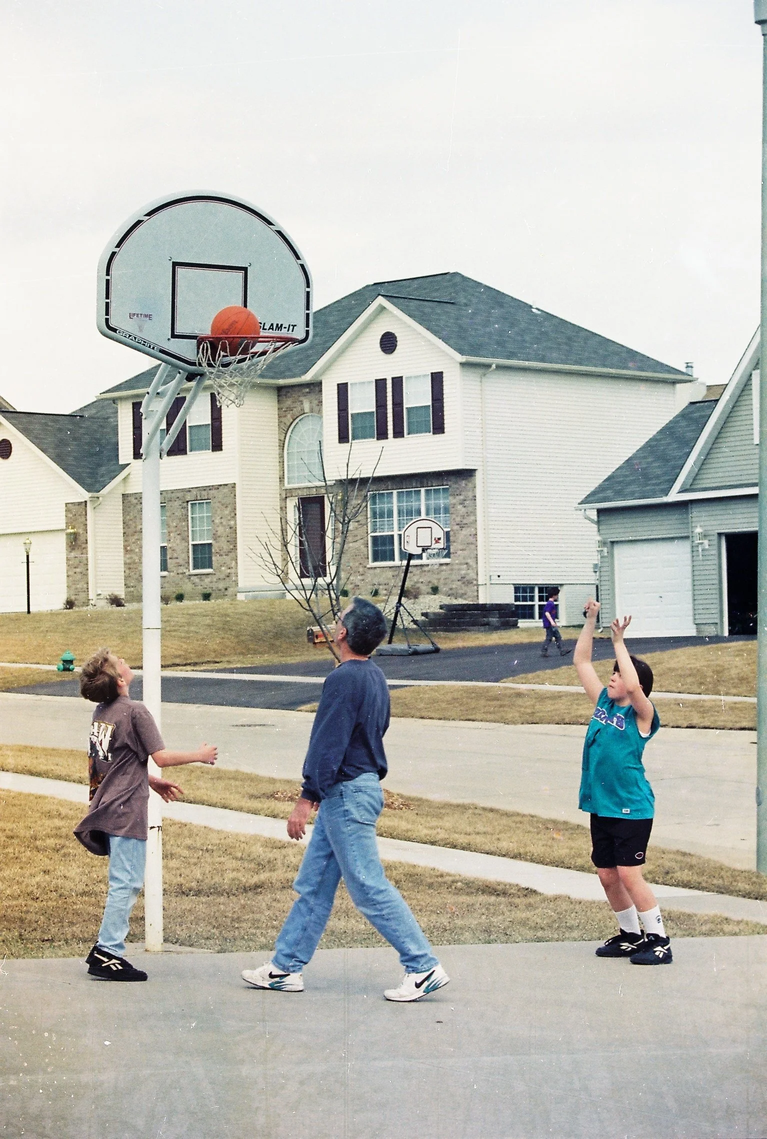 Mike, Caleb & Katie shooting hoops