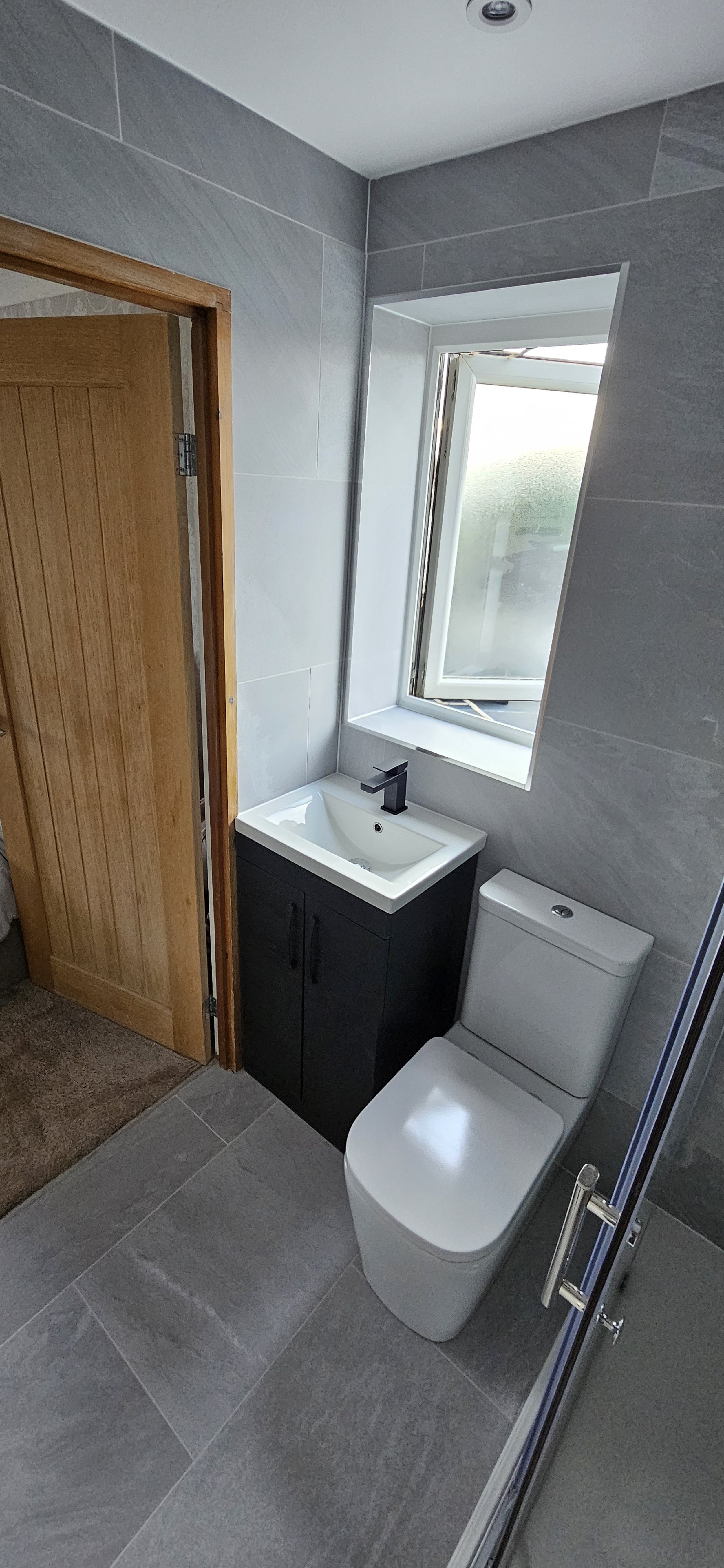 We relocated the basin and toilet by amending the soil pipe work externally