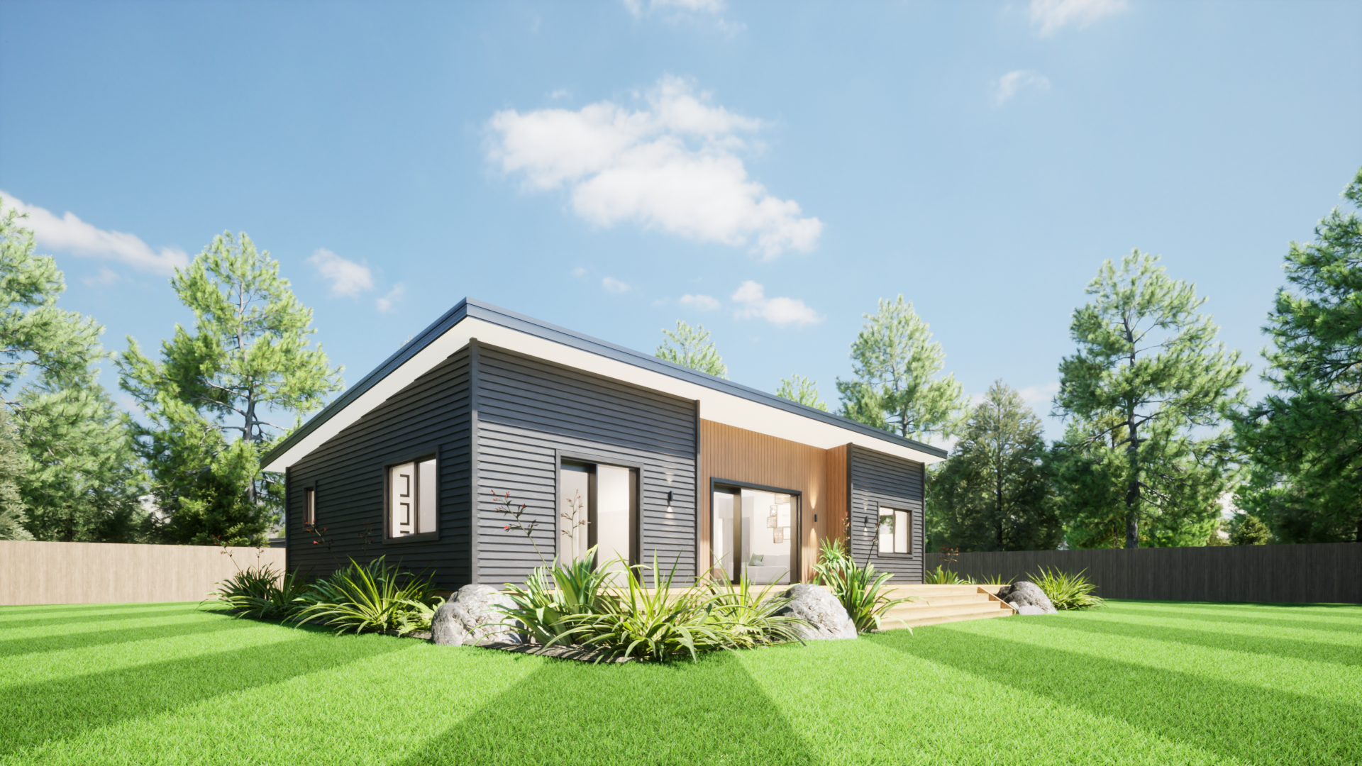 Modern single-story house with dark siding and wooden accents, surrounded by a lush green lawn with landscaping rocks and plants, tall trees in the background, under a bright blue sky with a few clouds.