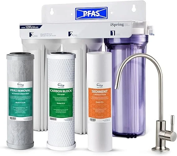 Reverse osmosis water filter system with four filter cartridges labeled PFAS Removal, Carbon Block, Sediment, and a large purple water storage tank with a drinking water faucet.