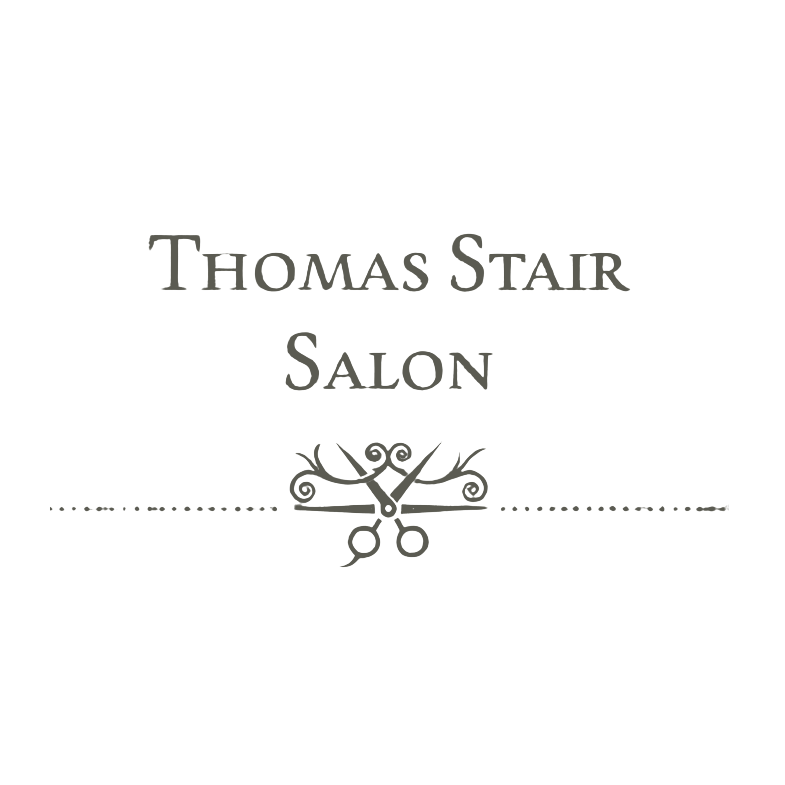 Black salon sign with gray decorative scissors and text reading 'Thomas Starr Salon.'
