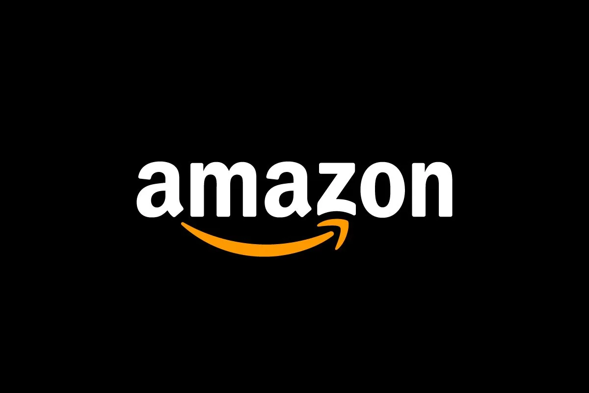 Amazon logo with black background and white text, orange arrow underneath the text.