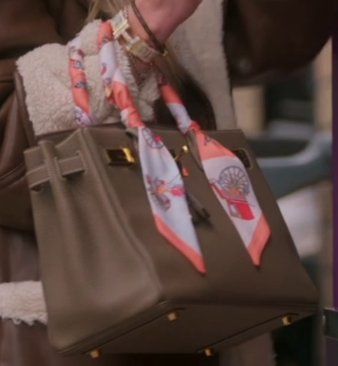 Close-up of Hailey Glassman's Etoupe Hermès Birkin 30 with gold hardware, clochette and Twilly