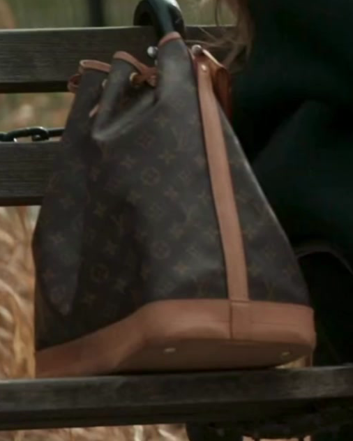 Close-up of Daisy Toye's vintage Louis Vuitton Noé bucket bag in Monogram canvas with honey-colored vachetta trim.