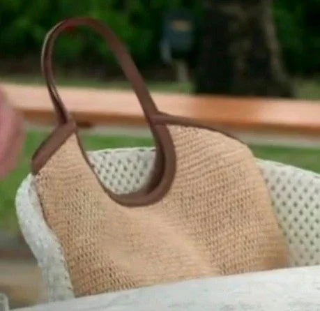 Close-up of Carole Radziwill's MZ Wallace Large Crochet Georgica Tote in natural crochet with a single brown leather loop handle.