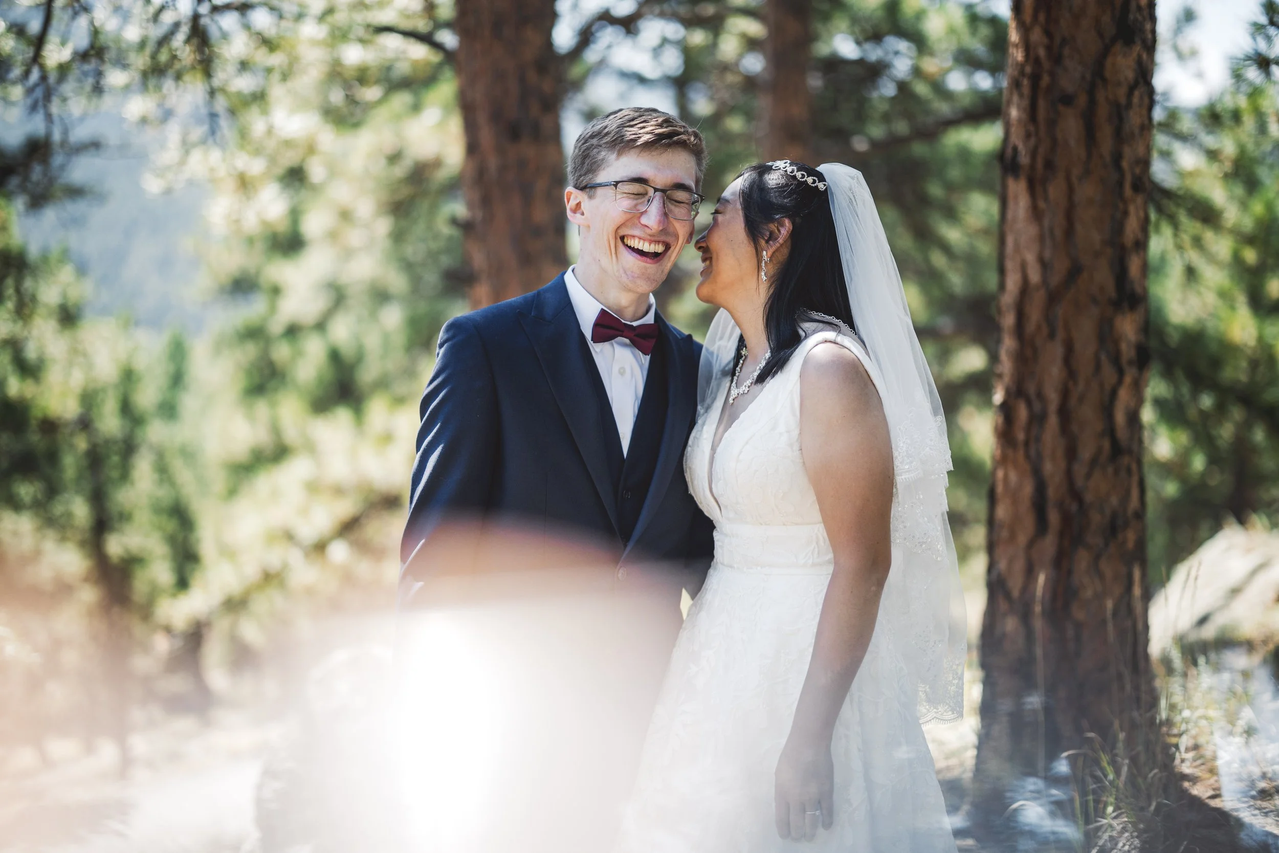 newlywed couple laughing