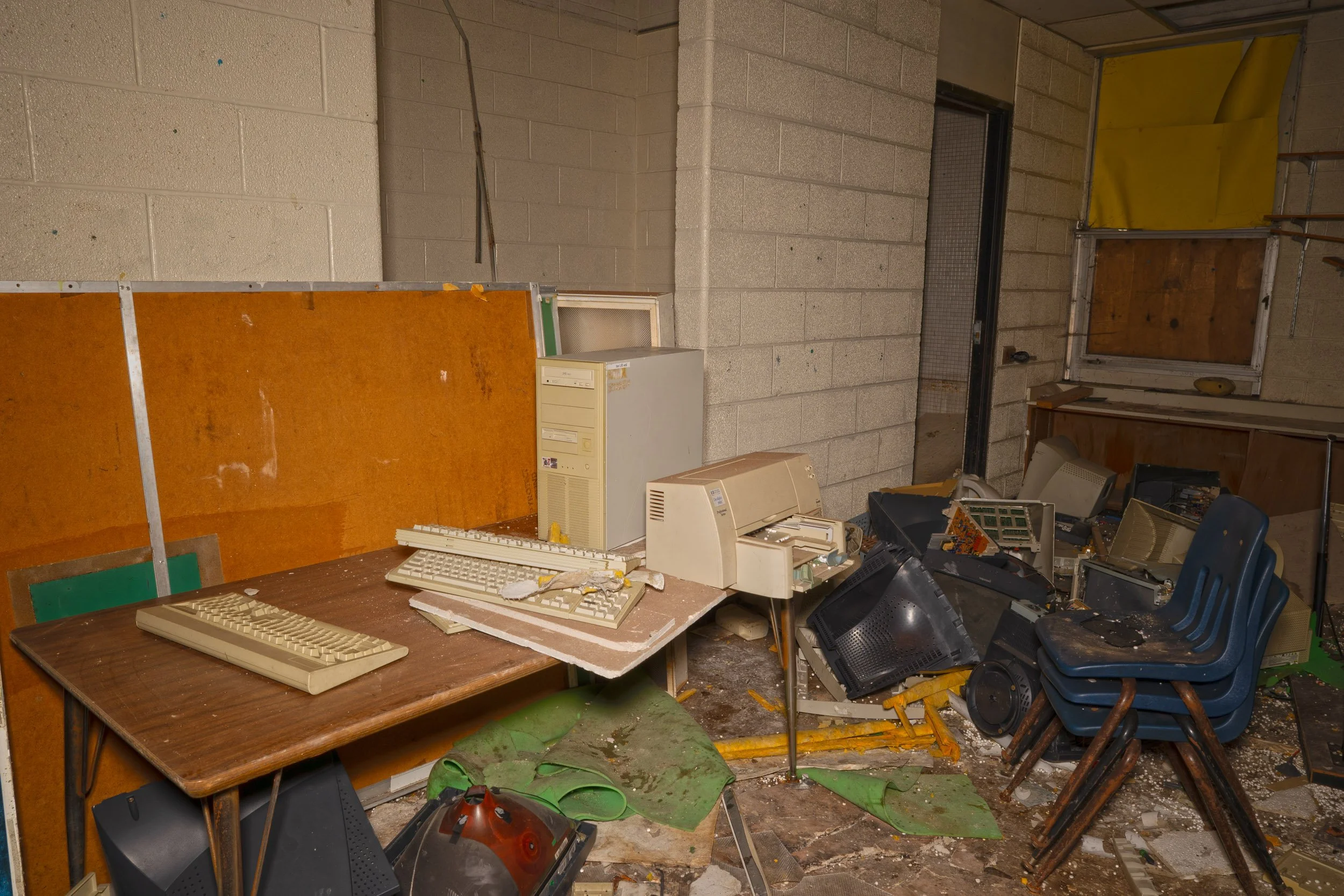 1st floor classroom with a intact computer likely a windows 98 or earlier computer