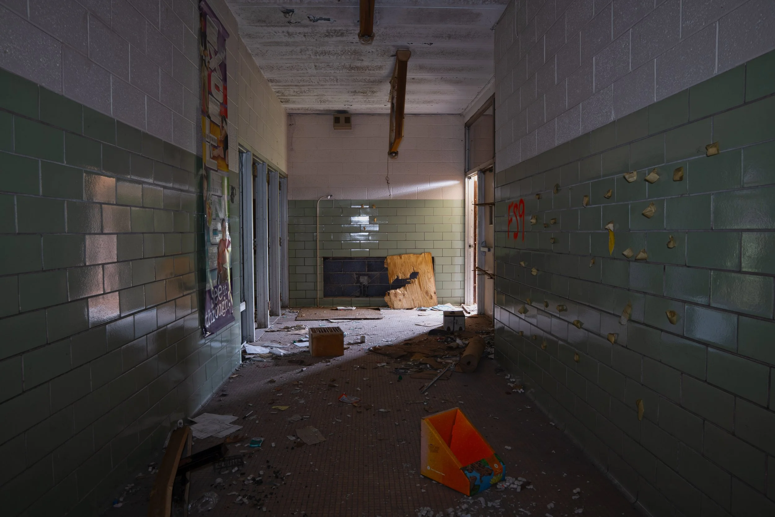Small hallway leading to auditorium behind the camera 