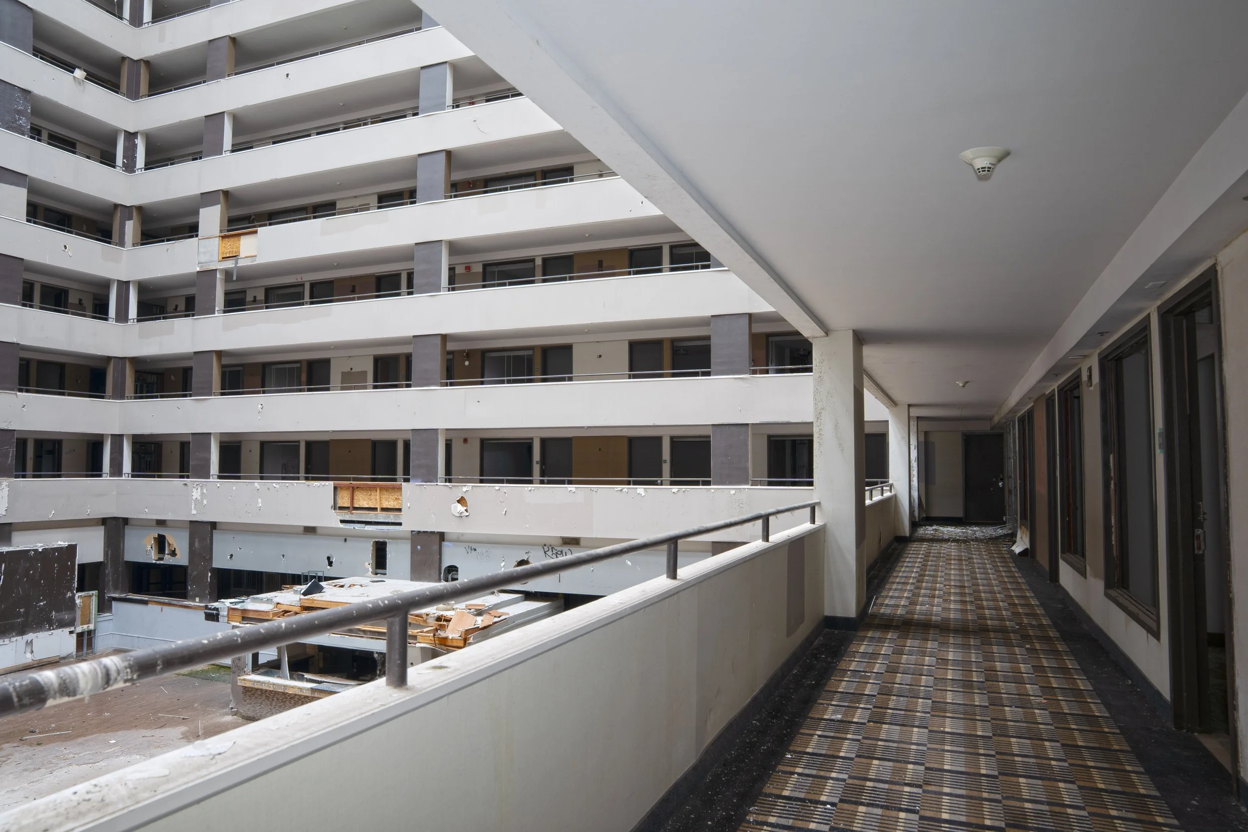 2nd floor hallway with atrium on the left