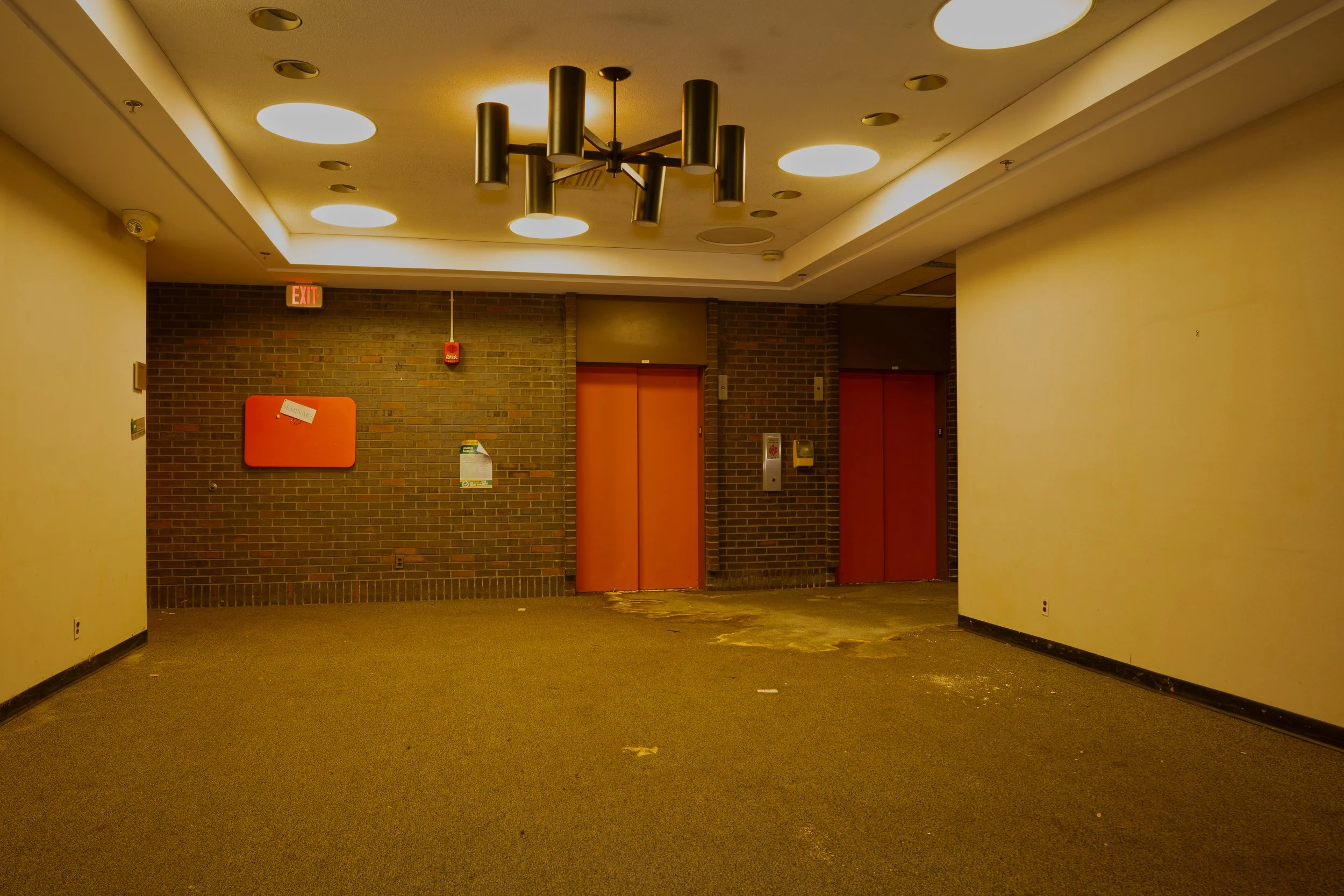 Main basement corridor with elevators in the background