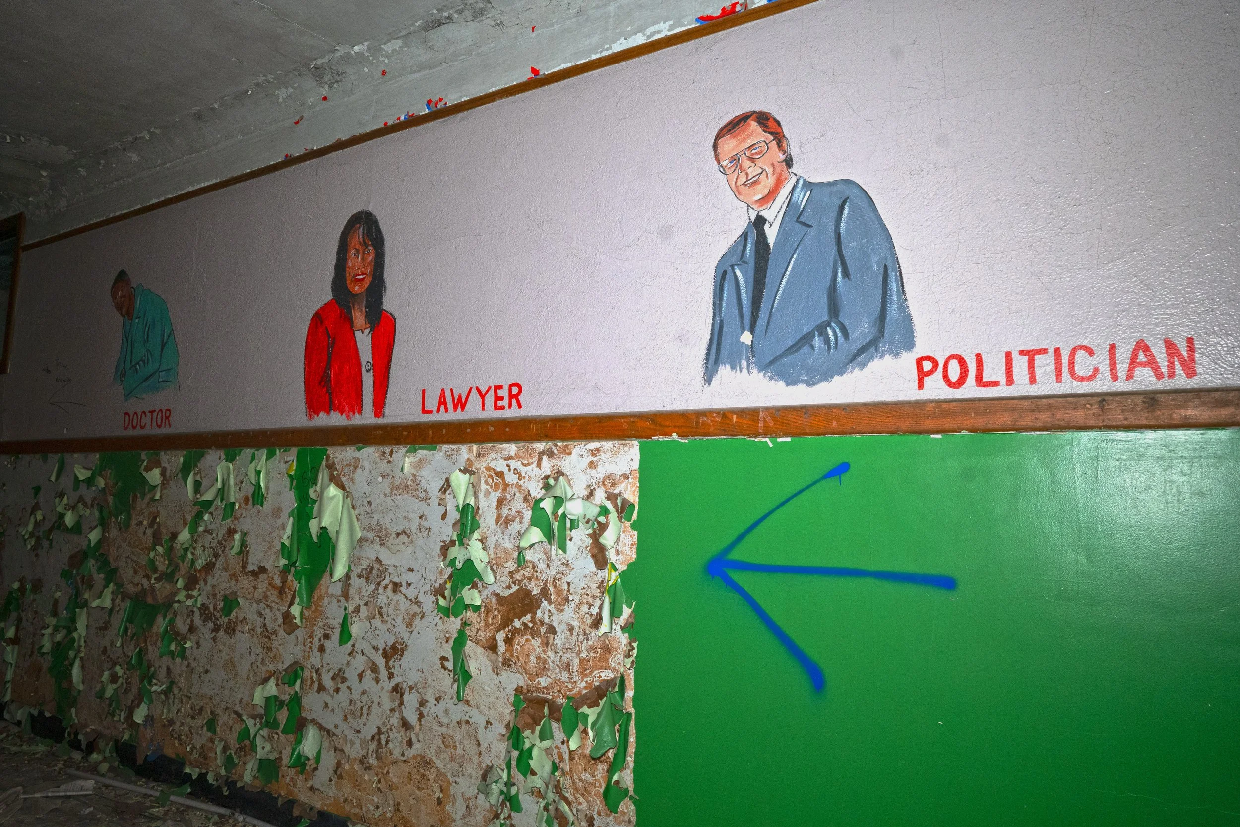 Mural in the small section of the U shaped floor plan this would be above the civil rights mural on the 1st floor. This mural displays many notable career choices 