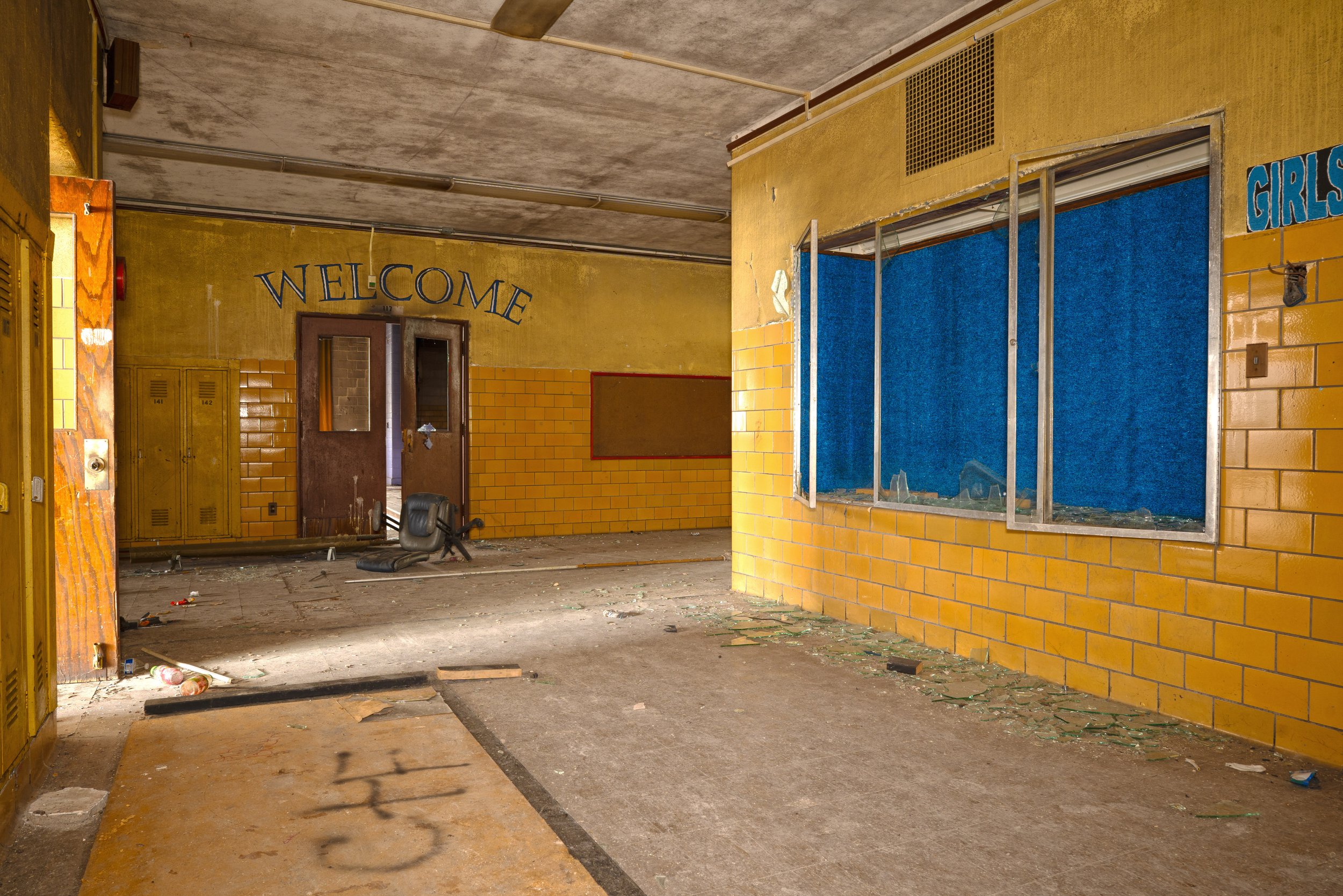 a welcome mural is present above the auditorium entrance 