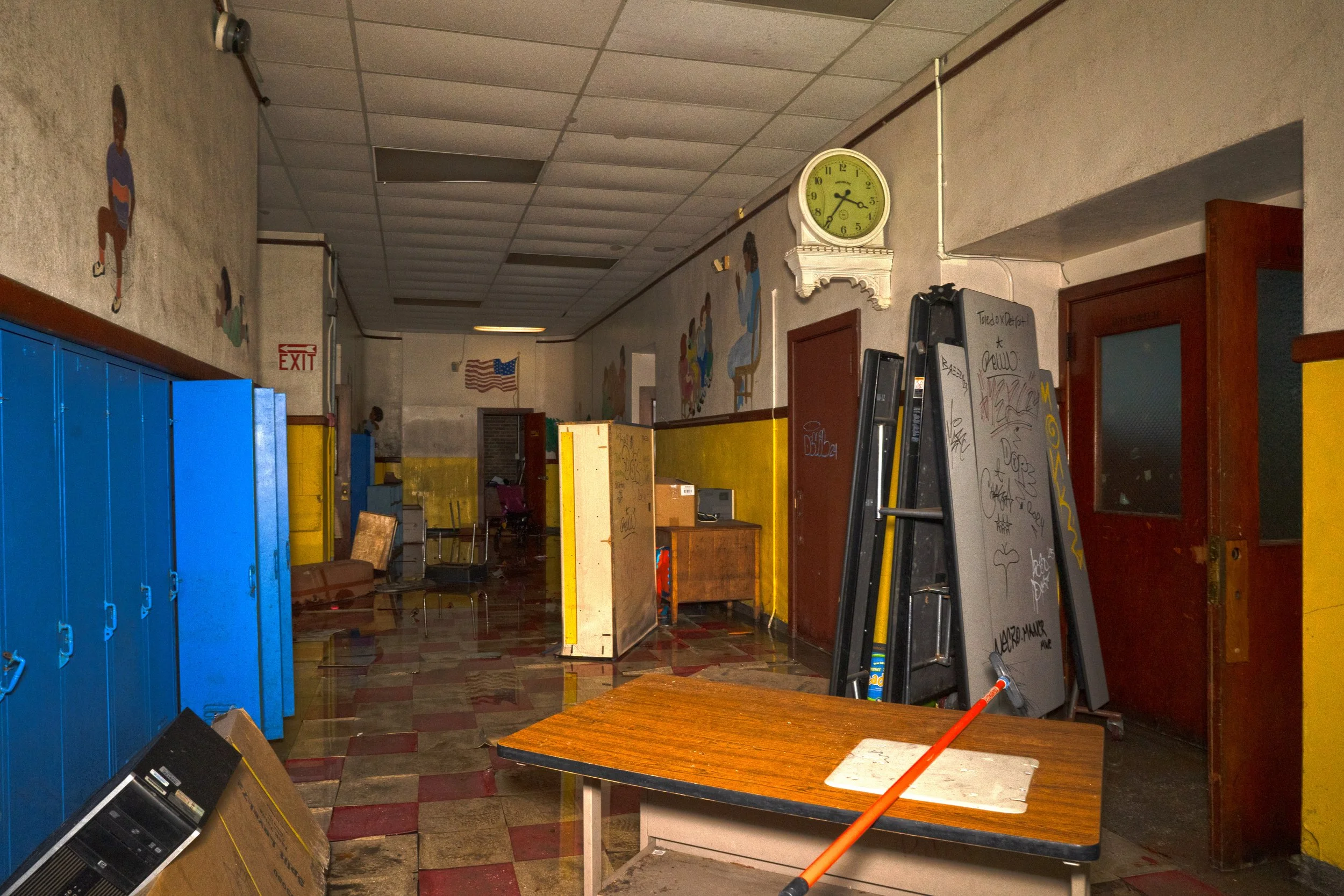 1st floor hallway with a light still on above the American flag