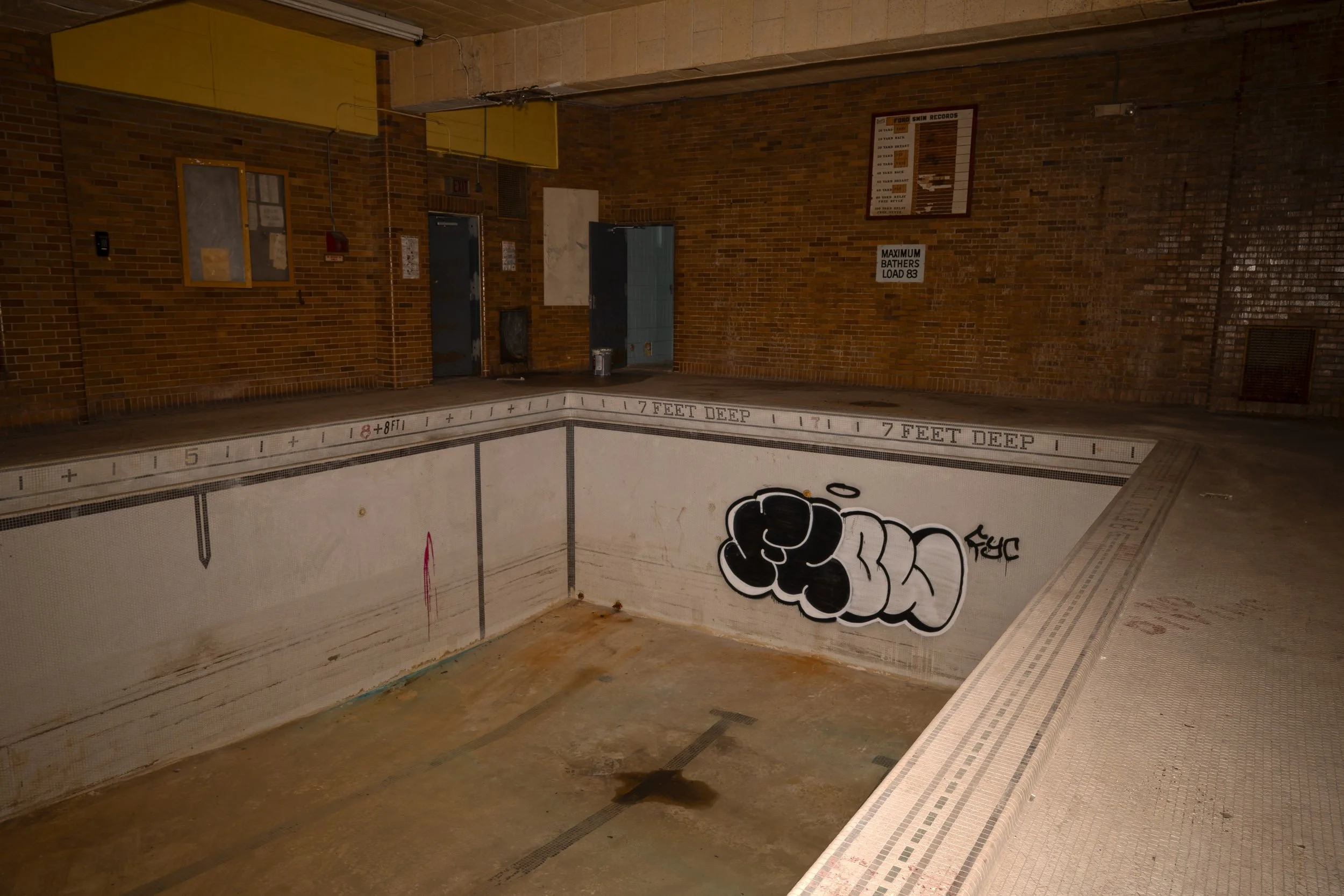 A single piece of graffiti lines the pool section