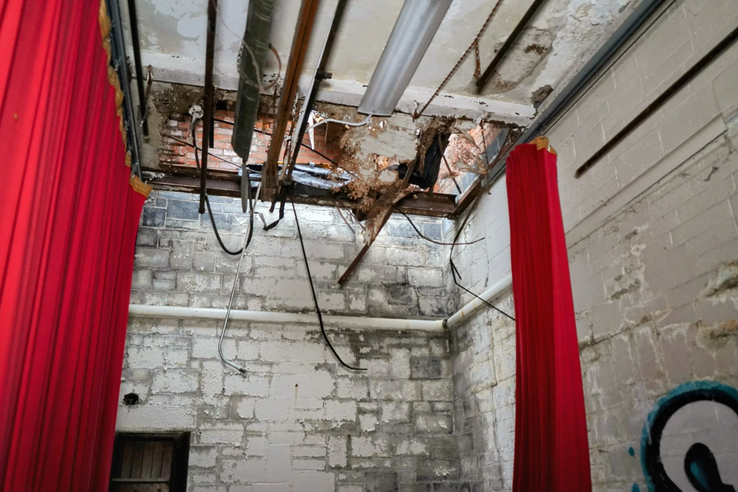 Roof damage above left side stage