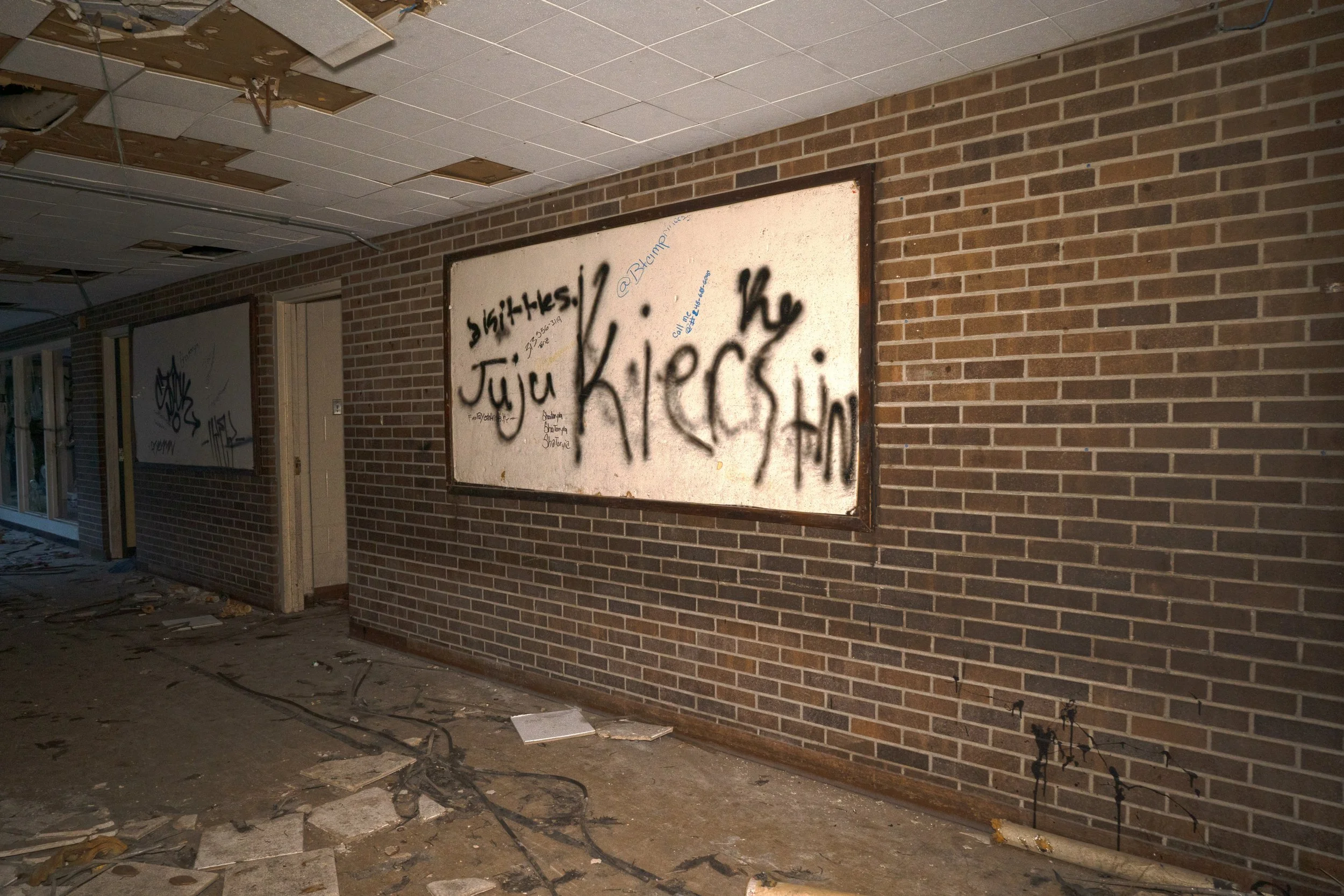 A board for school events nearby one of the entrances to the school