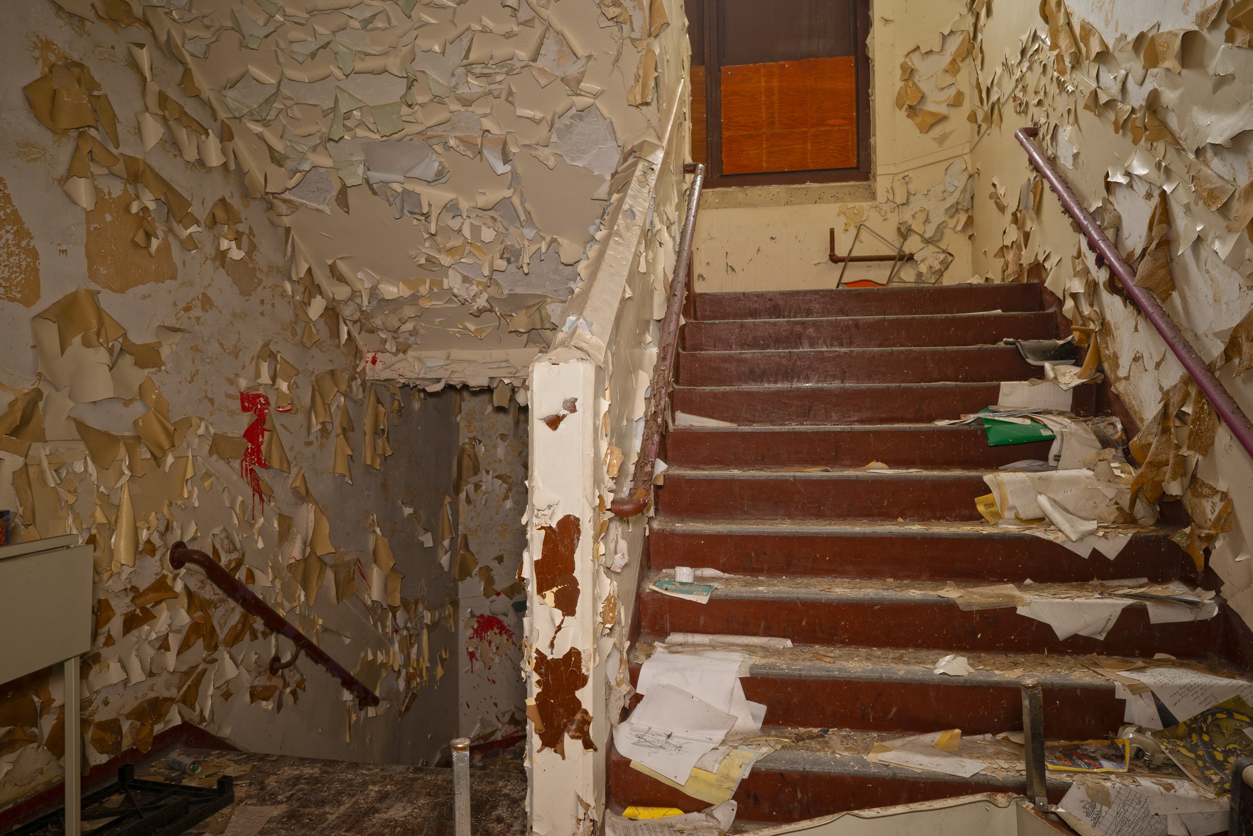 staircase on the 1st floor above is the 2nd floor below is the basement level