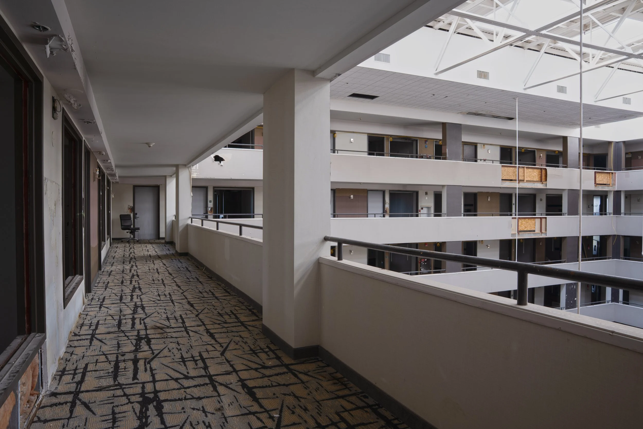 8th floor hallway with atrium on the right