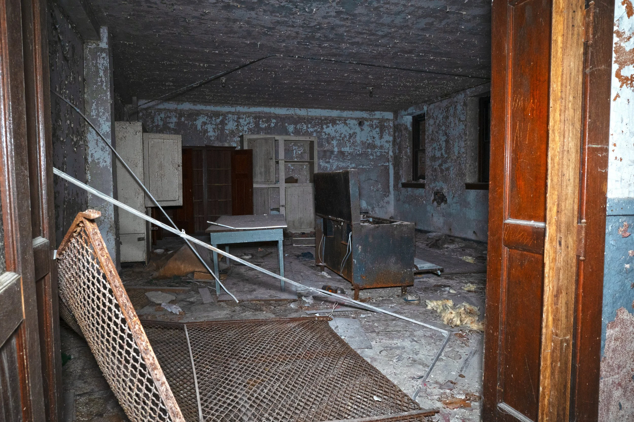 The first floor acts a basement type of level being partiality built underground  