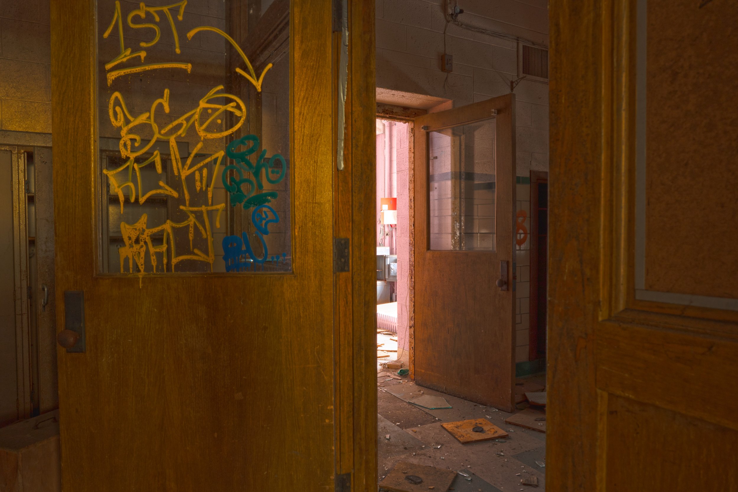 Nearby a storage room on the 1st floor on the western side of the school