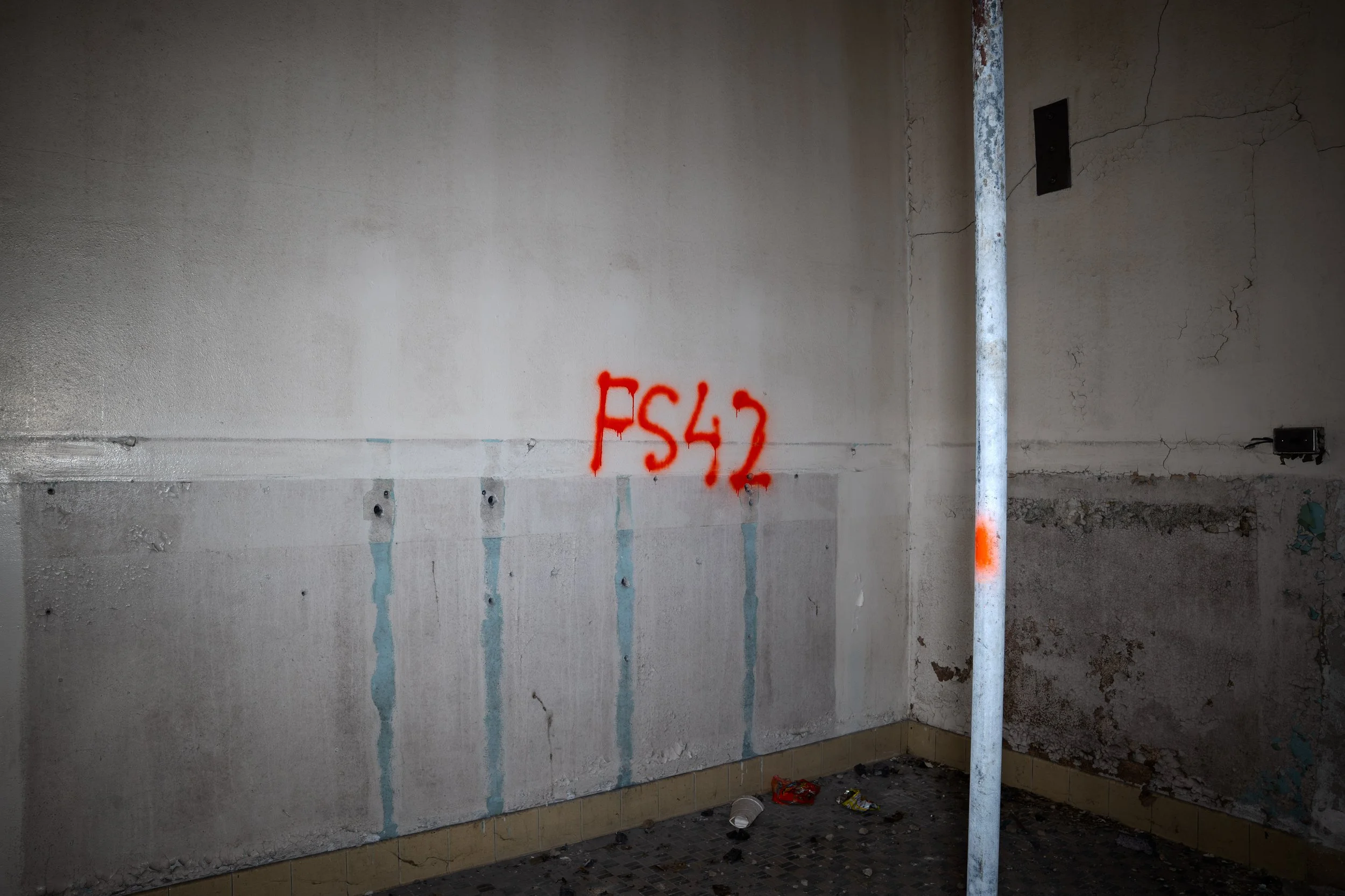 The walls of the coat rack adjacent to the Kindergarten room has been scrapped out 