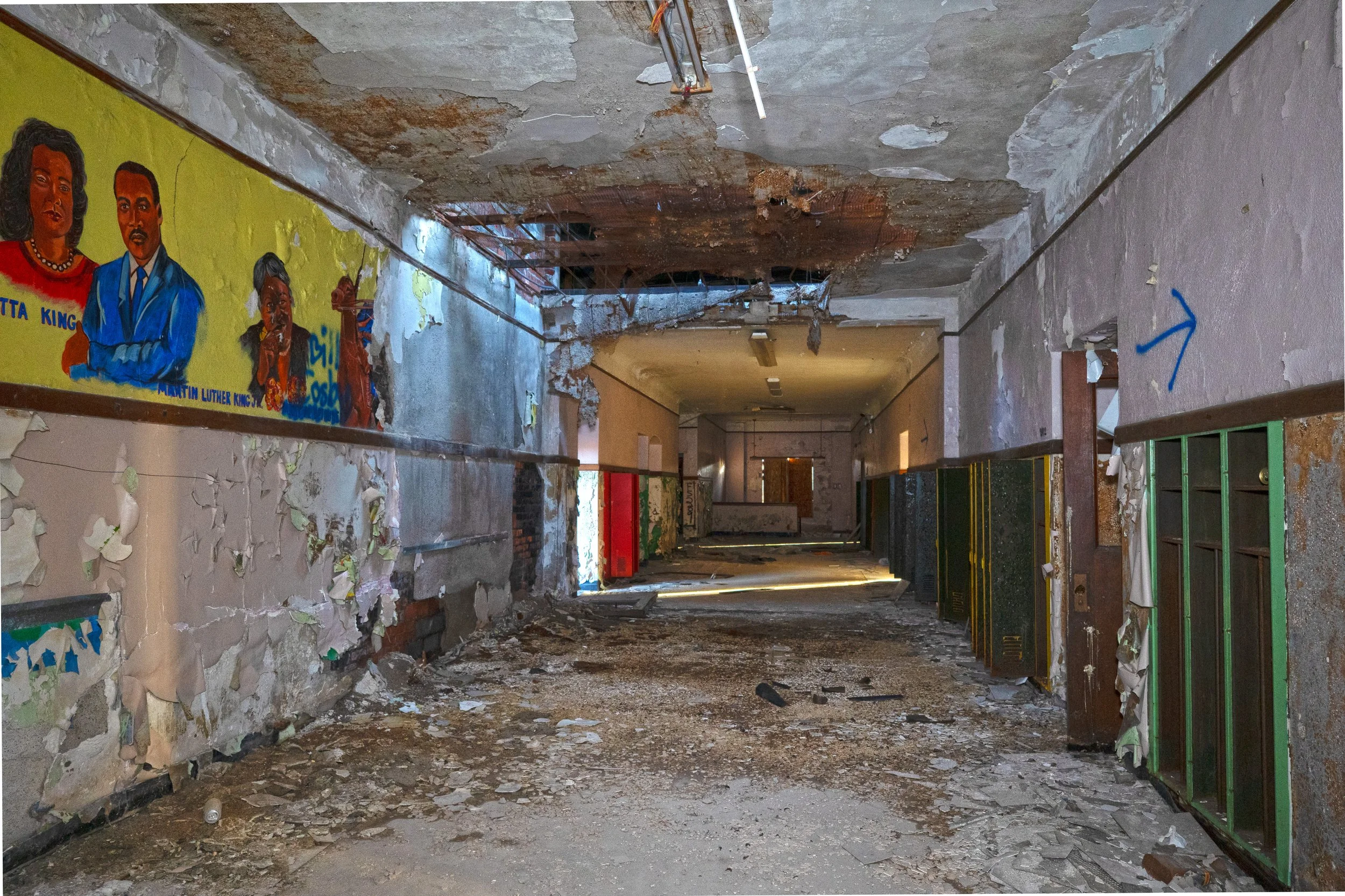 Long section of 2nd floor hallway leading to a nearly perfectly intact section of the school