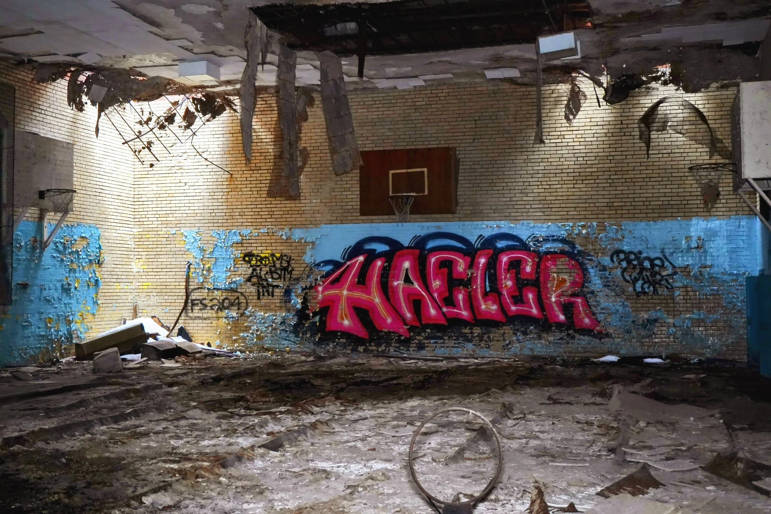 gymnasium shot 8 (Closeup of roof damage adding to a unique scene
