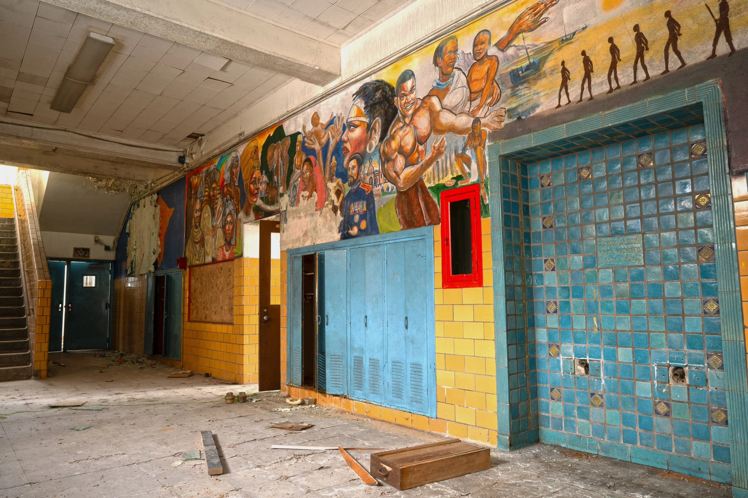 Murals on the 1st floor shot (alongside a tiled drinking fountain design)