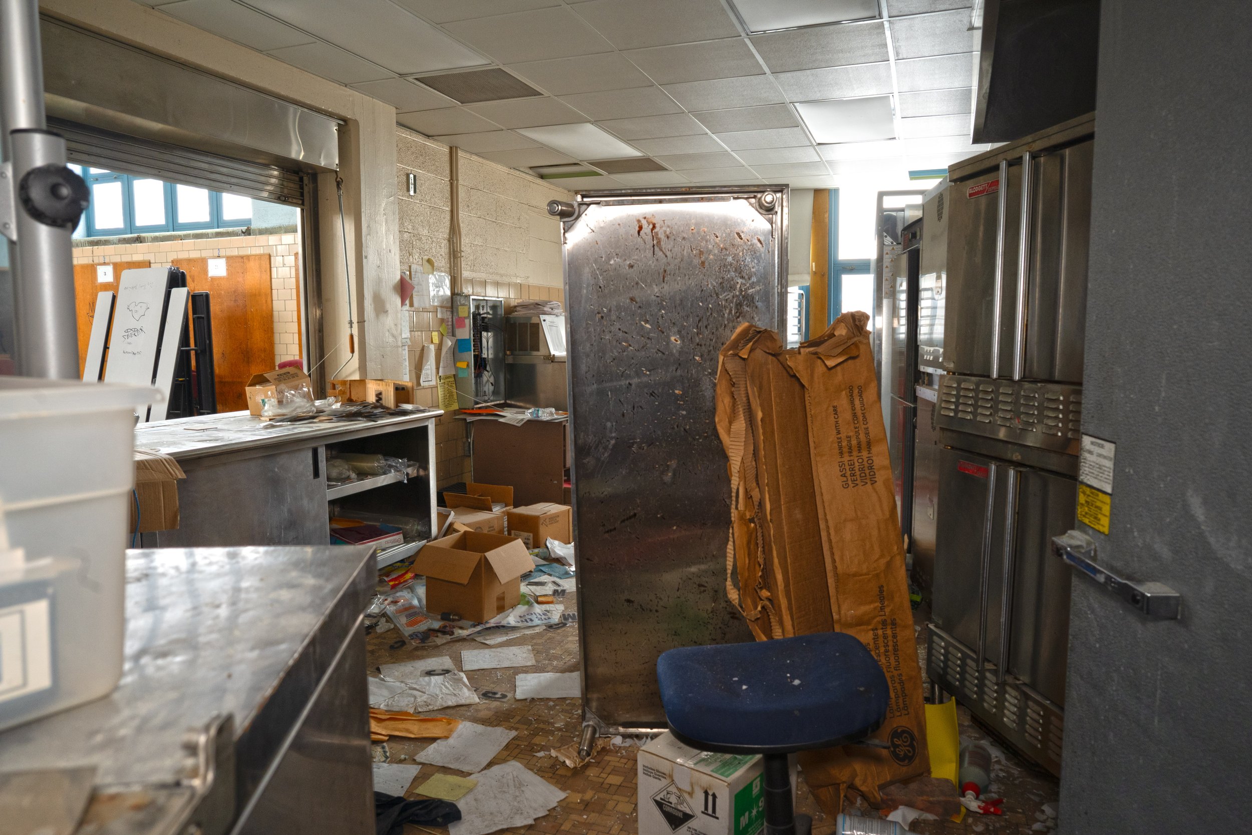 Kitchen located next to gymnasium 